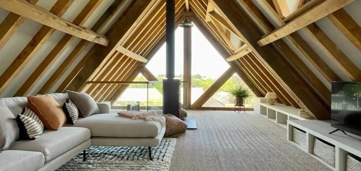 Vaulted oak-beamed lounge with log burner